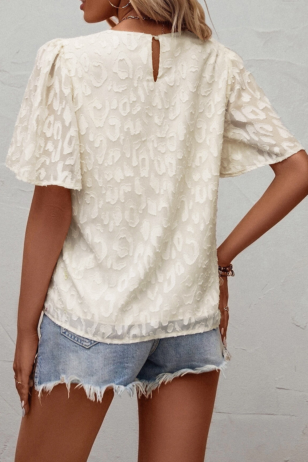 Blusa con mangas de mariposa en jacquard elegante beige