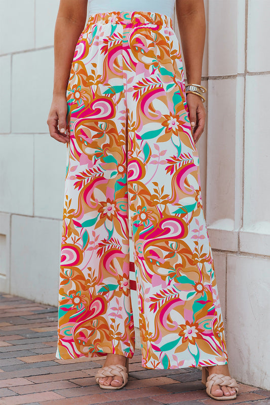 Pantalones anchos con estampado floral naranja