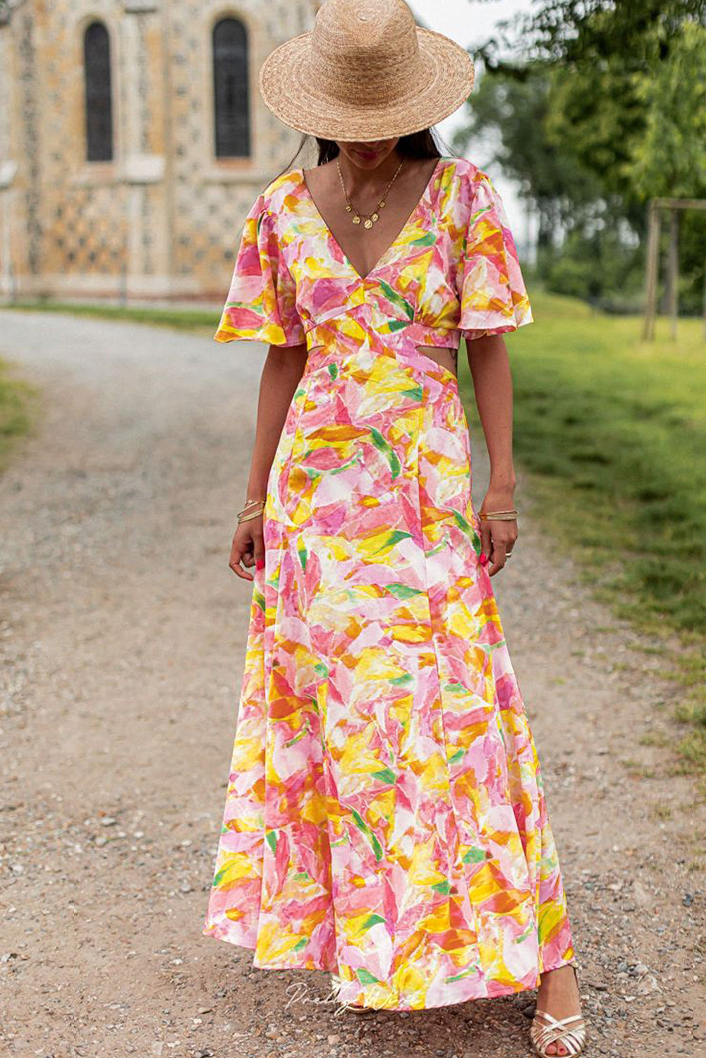 Vestido largo bohemio con estampado floral y mangas acampanadas rosa