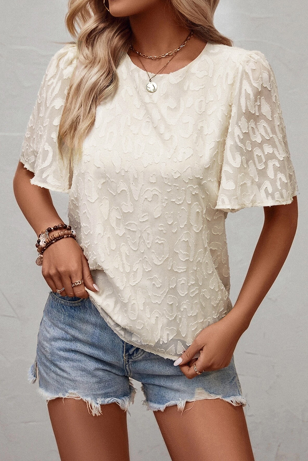 Blusa con mangas de mariposa en jacquard elegante beige