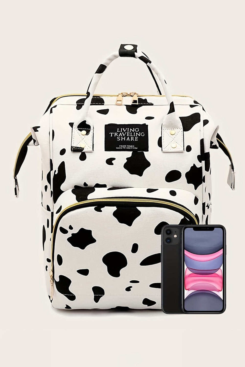 Mochila de lona con múltiples bolsillos y estampado de manchas de vaca blanca