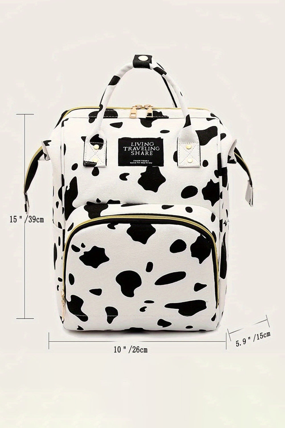 Mochila de lona con múltiples bolsillos y estampado de manchas de vaca blanca