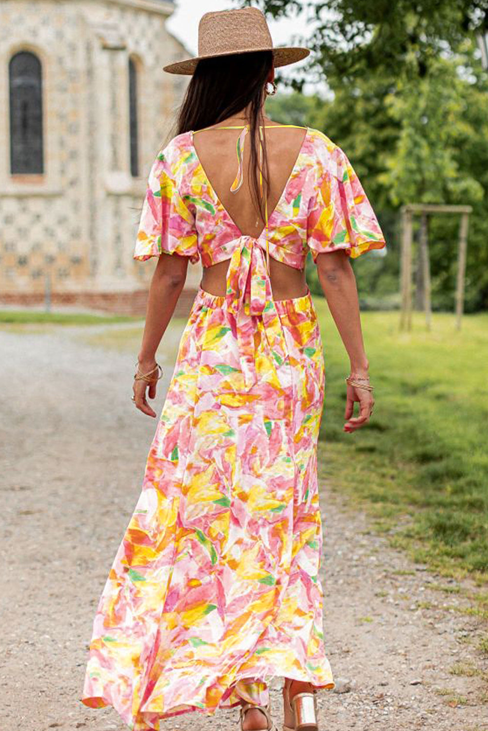 Vestido largo bohemio con estampado floral y mangas acampanadas rosa